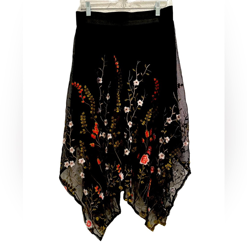 Floral embroidered netted skirt .